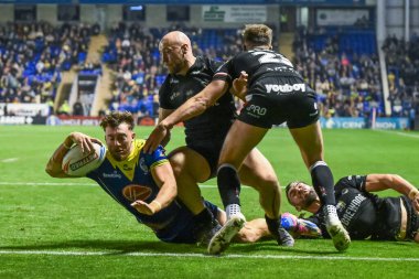 Warrington Wolves 'tan Matty Ashton, 20 Eylül 2024' te Halliwell Jones Stadyumu, Warrington 'da oynanan 27. Warrington Wolves-London Broncos maçında bir hat-trick yapmak için sahaya çıkıyor.