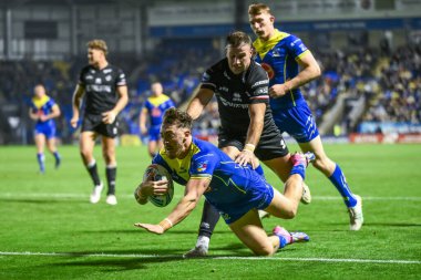 Josh Drinkwater of Warrington Wolves signs an autograph for a young fans as he arrives ahead of the Betfred Super League Round 27 match Warrington Wolves vs London Broncos at Halliwell Jones Stadium, Warrington, United Kingdom, 20th September 202 clipart