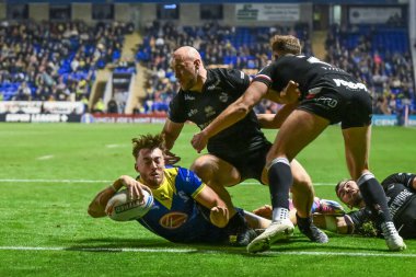 Warrington Wolves 'tan Matty Ashton, 20 Eylül 2024' te Halliwell Jones Stadyumu, Warrington 'da oynanan 27. Warrington Wolves-London Broncos maçında bir hat-trick yapmak için sahaya çıkıyor.