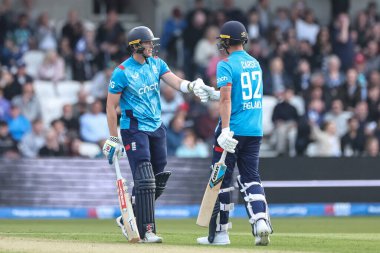 Brydon Carse of England fist-bumps Jamie Smith of England after he hits a six during the Second Metro Bank One Day International England v Australia at Headingley Cricket Ground, Leeds, United Kingdom, 21st September 2024 clipart