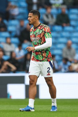 William Saliba of Arsenal during the pre-game warmup ahead the Premier League match Manchester City vs Arsenal at Etihad Stadium, Manchester, United Kingdom, 22nd September 2024 clipart