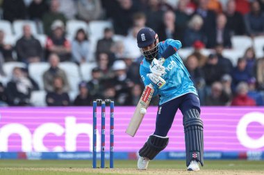 Adil Rashid of England hits the ball for two runs during the Second Metro Bank One Day International England v Australia at Headingley Cricket Ground, Leeds, United Kingdom, 21st September 2024 clipart