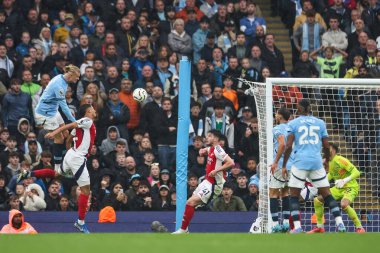 Erling Haaland of Manchester City heads on goal during the Premier League match Manchester City vs Arsenal at Etihad Stadium, Manchester, United Kingdom, 22nd September 2024 clipart