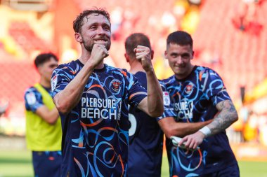 Matthew Pennington of Blackpool celebrates after the teams victory following the Sky Bet League 1 match Charlton Athletic vs Blackpool at The Valley, London, United Kingdom, 21st September 2024 clipart