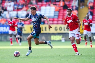 Kyle Joseph of Blackpool is put under pressure by Rarmani Edmonds-Green of Charlton Athletic during the Sky Bet League 1 match Charlton Athletic vs Blackpool at The Valley, London, United Kingdom, 21st September 2024 clipart