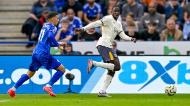 Abdoulaye DOUCOURE (Everton FC) attacking with the ball with Bilal EL KHANNOUSS (Leicester City) giving chase during the Premier League match Leicester City vs Everton at King Power Stadium, Leicester, United Kingdom, 21st September 2024 clipart