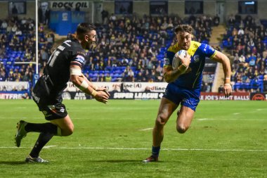 Warrington Wolves 'tan Matty Ashton, 27. Betfred Süper Lig Turu' nda Warrington Wolves, Londra Broncos 'a karşı Halliwell Jones Stadyumu, Warrington, İngiltere' de 20 Eylül 2024 'te oynanan karşılaşmada ilk hamlesini yaptı.