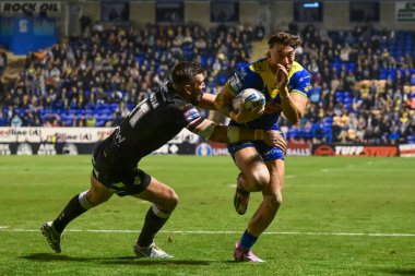 Matty Ashton of Warrington Wolves is tackled by Will Lovell of London Broncos during the Betfred Super League Round 27 match Warrington Wolves vs London Broncos at Halliwell Jones Stadium, Warrington, United Kingdom, 20th September 2024 clipart