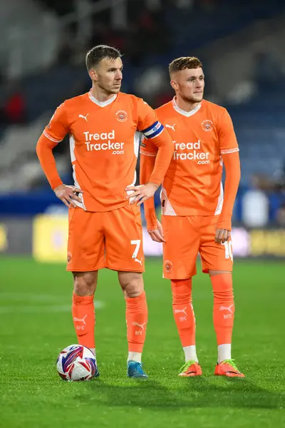 stock image Lee Evans and Sonny Carey of Blackpool prepare to take a free kick during the Sky Bet League 1 match Huddersfield Town vs Blackpool at John Smith's Stadium, Huddersfield, United Kingdom, 24th September 2024