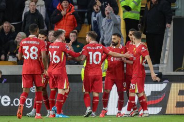 Liverpool 'dan Muhammed Salah, 28 Eylül 2024' te İngiltere 'nin Wolverhampton kentinde oynanan Premier League maçında Wolverhampton Wanderers' a karşı Liverpool maçında 1-2 kazanma hedefini kutluyor.