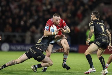 Brad Singleton of Salford Red Devils is tackled by Zak Hardaker of Leigh Leopards during the Betfred Super League play-off Eliminator 1 Salford Red Devils v Leigh Leopards at Salford Community Stadium, Eccles, United Kingdom, 27th September 2024 clipart