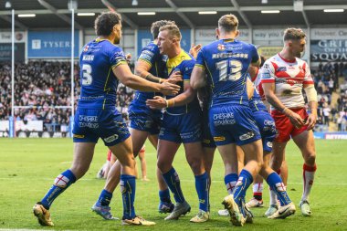 Warrington Wolves 'tan Matty Ashton, 28 Eylül 2024' te İngiltere 'nin Warrington şehrindeki Halliwell Jones Stadyumu' nda oynanan Betfred Süper Lig play-off eleme karşılaşmasında şansını kutluyor.