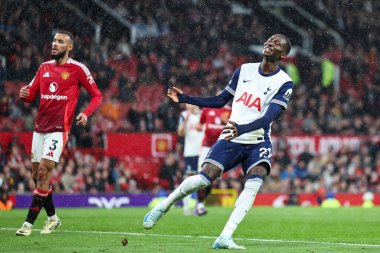 Pape Matar Sarr of Tottenham Hotspur reacts after missing a chance on goal during the Premier League match Manchester United vs Tottenham Hotspur at Old Trafford, Manchester, United Kingdom, 29th September 2024 clipart