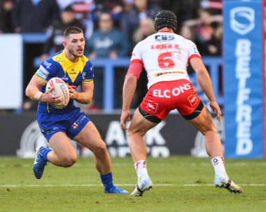 Warrington Wolves 'tan Danny Walker, 28 Eylül 2024' te İngiltere 'nin Warrington şehrinde oynanan Betfred Süper Lig eleme maçında 2 Warrington Wolves St. Helens' a karşı oynadığı maçta ilk hamlesini yaptı.