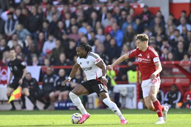 Fulham FC 'den Adama TRAORE, Nottingham Forrest takımından Ryan YATES ile 28 Eylül 2024' te Nottingham City Ground, Nottingham, İngiltere 'de oynanan Premier Lig maçında defans oyuncusu Nottingham Forest' e karşı Fulham 'ı savundu.