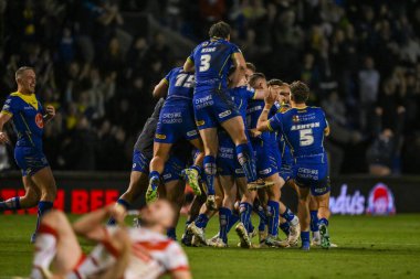Warrington Wolves 'tan George Williams, 28 Eylül 2024' te Warrington, İngiltere 'deki Halliwell Jones Stadyumu' nda oynanan Betfred Süper Lig play-off eleme maçı 2 Warrington Wolves-St Helens maçını kazanmak için attığı golü kutluyor.