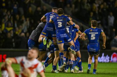 Warrington Wolves 'tan George Williams, 28 Eylül 2024' te Warrington, İngiltere 'deki Halliwell Jones Stadyumu' nda oynanan Betfred Süper Lig play-off eleme maçı 2 Warrington Wolves-St Helens maçını kazanmak için attığı golü kutluyor.