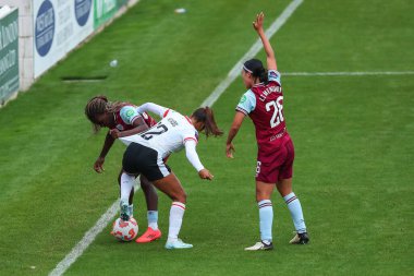 Taylor Hinds of Liverpool battles for the ball with Viviane Asseyi and Li Mengwen of West Ham United during the The FA Women's Super League match West Ham United Women vs Liverpool Women at The Chigwell Construction Stadium, London, United Kingdom  clipart