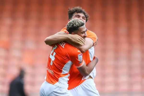 stock image Kyle Joseph of Blackpool and Jordan Lawrence-Gabriel of Blackpool celebrate their teams win after the Sky Bet League 1 match Blackpool vs Burton Albion at Bloomfield Road, Blackpool, United Kingdom, 28th September 2024