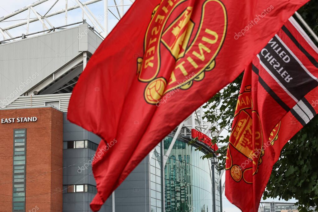 A view of Old Trafford though some Man Utd flags during the Premier League match Manchester United vs Tottenham Hotspur at Old Trafford, Manchester, United Kingdom, 29th September 202