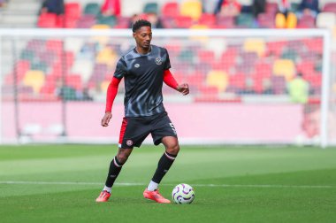 Ethan Pinnock of Brentford warms up prior to the Premier League match Brentford vs West Ham United at The Gtech Community Stadium, London, United Kingdom, 28th September 2024 clipart