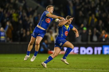 Warrington Wolves 'tan George Williams, 28 Eylül 2024' te İngiltere 'nin başkenti Warrington' da oynanan Halliwell Jones Stadyumu 'nda oynanan Betfred Süper Lig play-off elemeleri 2 Warrington Wolves St Helens' ı kazanmak için attığı golü ekstra zaman kutluyor.
