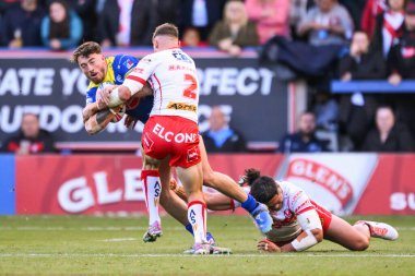 Warrington Wolves 'tan Matty Ashton, 28 Eylül 2024' te İngiltere 'nin Warrington kentinde oynanan Betfred Süper Lig eleme maçında St. Helens' a karşı oynadığı 2 Warrington Wolves maçında St. Helens 'in St. Helens maçında St. Helens' li Tommy Makinson ile karşı karşıya geldi.