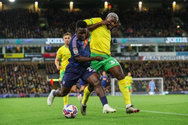 Wilfried Gnonto of Leeds United is put under pressure by Jose Cordoba of Norwich City during the Sky Bet Championship match Norwich City vs Leeds United at Carrow Road, Norwich, United Kingdom, 1st October 2024 clipart