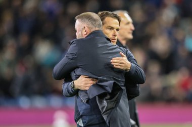 Wayne Rooney manager of Plymouth Argyle embraces Scott Parker manager of Burnley before the game during the Sky Bet Championship match Burnley vs Plymouth Argyle at Turf Moor, Burnley, United Kingdom, 1st October 2024 clipart