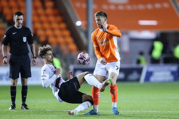 stock image Tom Bayliss of Lincoln City tackles Lee Evans of Blackpool during the Sky Bet League 1 match Blackpool vs Lincoln City at Bloomfield Road, Blackpool, United Kingdom, 1st October 2024