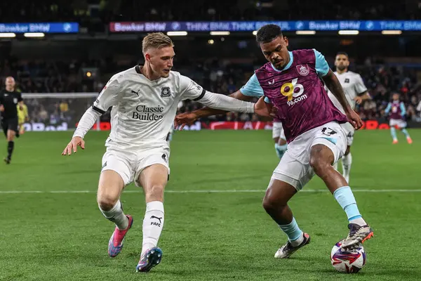 stock image Kornl Szcs of Plymouth Argyle and Lyle Foster of Burnley battle for the ball during the Sky Bet Championship match Burnley vs Plymouth Argyle at Turf Moor, Burnley, United Kingdom, 1st October 2024