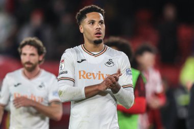 Swansea City 'den Myles Peart-Harris, 2 Ekim 2024' te Bramall Lane, Sheffield, İngiltere 'de oynanan Sky Bet Şampiyonası maçından sonra gezgin taraftarları alkışlıyor.