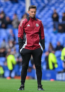 Jason Tindall Assistant Manager of Newcastle United watches on the warm ups during the Premier League match Everton vs Newcastle United at Goodison Park, Liverpool, United Kingdom, 5th October 2024 clipart