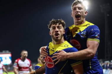 Warrington Wolves takımından Matty Ashton, 4 Ekim 2024 tarihinde İngiltere 'nin Hull kenti Kingston' da oynanan Sewell Group Craven Park 'taki Hull KR vs Warrington Wolves maçında denemelerini kutluyor.