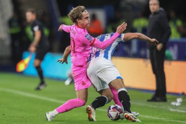 Josh Benson of Barnsley tackles Matty Pearson of Huddersfield Town during the Bristol Street Motors Trophy match Huddersfield Town vs Barnsley at John Smith's Stadium, Huddersfield, United Kingdom, 8th October 2024 clipart