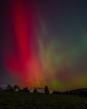 Northern Lights also know as the Aurora Borealis shines across Whitby Harbour, Whitby, United Kingdom, 10th October 2024 clipart