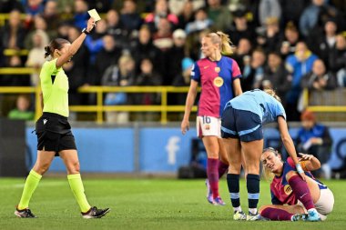 Laia Aleixandri receives yellow card after challenge on Alexia Putellas of Barcelona Femen during the UEFA Women's Champions League match Manchester City vs Barcelona at Manchester City Academy Stadium, Manchester, United Kingdom, 9th October 2024 clipart