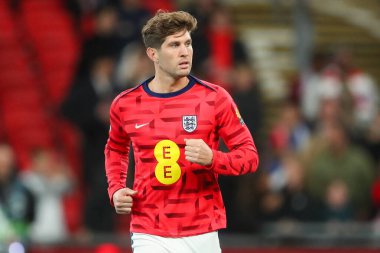 İngiltere 'den John Stones, UEFA Uluslar Ligi - B-Grubu B2 - 10 Ekim 2024' te Londra 'daki Wembley Stadyumu' nda İngiltere 'ye karşı Yunanistan maçından önce ısınıyor.