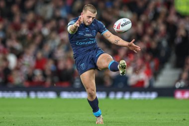 Mikey Lewis of Hull KR kicks the ball towards the goal line during the Betfred Super League Grand Final match Wigan Warriors vs Hull KR at Old Trafford, Manchester, United Kingdom, 12th October 2024 clipart