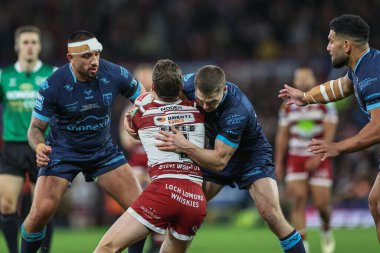 Hull KR 'dan Matt Parcell, 12 Ekim 2024' te Old Trafford, Manchester, Birleşik Krallık 'ta oynanan Betfred Süper Lig Grand League karşılaşmasında Wigan Warriors vs Hull KR' a karşı Jai Field of Wigan Warriors ile mücadele etti.