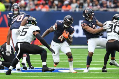 Chicago Bears takımından D 'Andre Swift, Chicago Bears' in Jacksonville Jaguars 'a karşı oynadığı Tottenham Hotspur Stadyumu' nda 13 Ekim 2024 'te arayı açıyor.