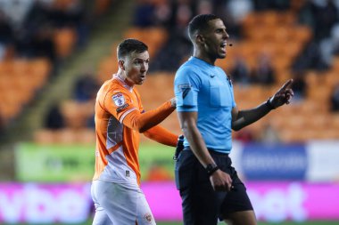 Lee Evans of Blackpool talks to referee Farai Hallam during the Sky Bet League 1 match Blackpool vs Wigan Athletic at Bloomfield Road, Blackpool, United Kingdom, 28th October 2024 clipart