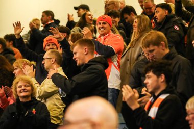 Blackpool fans celebrate the teams win following the Emirates FA Cup First Round match Gillingham vs Blackpool at MEMS Priestfield Stadium, Gillingham, United Kingdom, 2nd November 2024 clipart