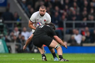 George Martin of England is tackled by Scott Barrett of New Zealand during the Autumn Nations Series match England vs New Zealand at Allianz Stadium, Twickenham, United Kingdom, 2nd November 2024 clipart