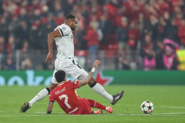 Jonathan Tah of Bayer Leverkusen beats Luis Daz of Liverpool to the ball during the UEFA Champions League, League Stage match Liverpool vs Bayer 04 Leverkusen at Anfield, Liverpool, United Kingdom, 5th November 2024 clipart