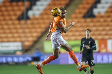 Jordan Rhodes of Blackpool jumps up to win the high ball during the Bristol Street Motors Trophy match Blackpool vs Liverpool U21 at Bloomfield Road, Blackpool, United Kingdom, 6th November 2024 clipart