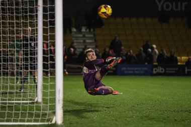 Dean Cornelius of Harrogate Town scores hIs penalty during the Bristol Street Motors Trophy match Harrogate Town vs Blackpool at Wetherby Road, Harrogate, United Kingdom, 12th November 2024 clipart