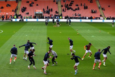 Blackpool players during the pre-game warm up ahead of the Sky Bet League 1 match Blackpool vs Northampton Town at Bloomfield Road, Blackpool, United Kingdom, 16th November 2024