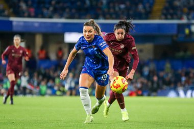 Johanna Rytting Kaneryd of Chelsea Women is put under pressure by Leila Ouahabi of Manchester City Women during the Barclays Women's Super League match Chelsea FC Women vs Manchester City Women at London, United Kingdom, 16th November, 2024 clipart