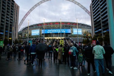 Fans make their way to Wembley Stadium during the UEFA Nations League, League B - Group 2 match England vs Republic of Ireland at Wembley Stadium, London, United Kingdom, 17th November 2024 clipart